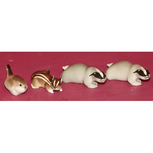 95 - 2 Russian china figures of badgers, 12cm long, a Russian figure of a chipmunk and a similar figure o... 