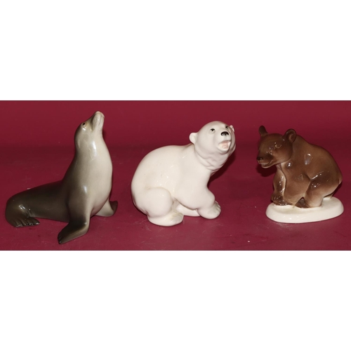 97 - A Russian china figure of a seal, 12.5cm high, a Russian china figure of a seated polar bear and a s... 