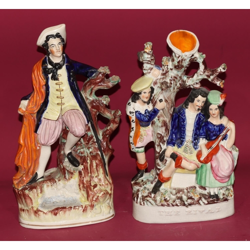 98 - A 19th Century Staffordshire group The Rivals, 33cm high and a 19th Century Staffordshire figure She... 