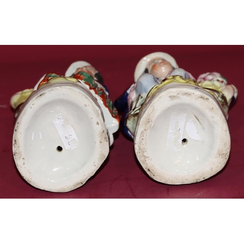 99 - A pair of 19th Century Staffordshire figures of gardeners, both 23cm high (2)