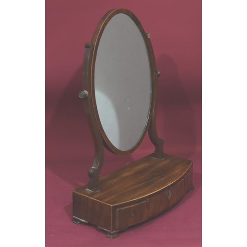 943 - A 19th Century mahogany oval swing box toilet mirror with inlaid stringing, 3 drawers on Ogee feet, ... 