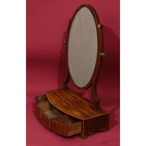 943 - A 19th Century mahogany oval swing box toilet mirror with inlaid stringing, 3 drawers on Ogee feet, ... 