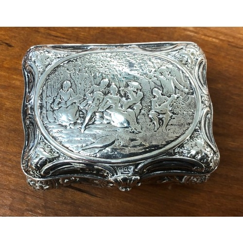 236 - A Continental imported silver rectangular scallop shaped snuff box with hinged lid and allover embos... 