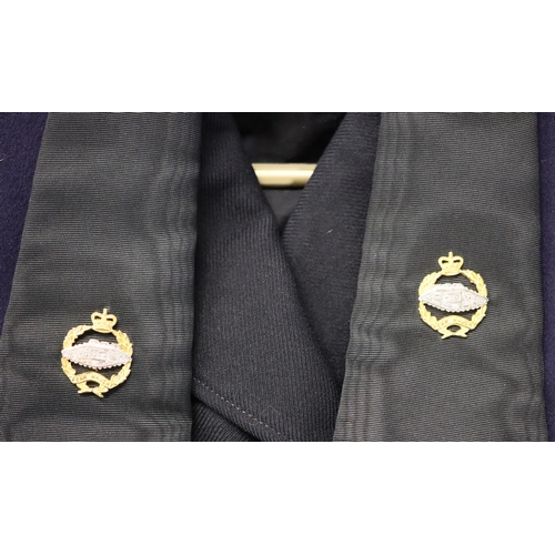 1015 - A navy blue tank regiment mess jacket and a similar style black jacket. (2)