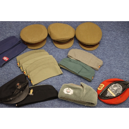 1020 - A quantity of various military dress caps.