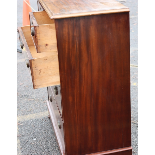 1023 - A mahogany straight front chest of drawers on bun feet, 98cm wide, 47cm deep, 110cm high. This Lot i... 