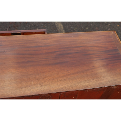 1023 - A mahogany straight front chest of drawers on bun feet, 98cm wide, 47cm deep, 110cm high. This Lot i... 