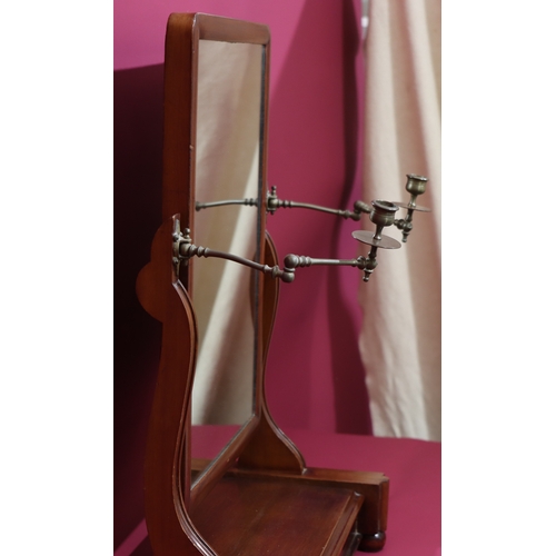 1028 - A mahogany toilet mirror on bun feet, with small drawer below, 2 hinged brass candle sconces, 71cm h... 