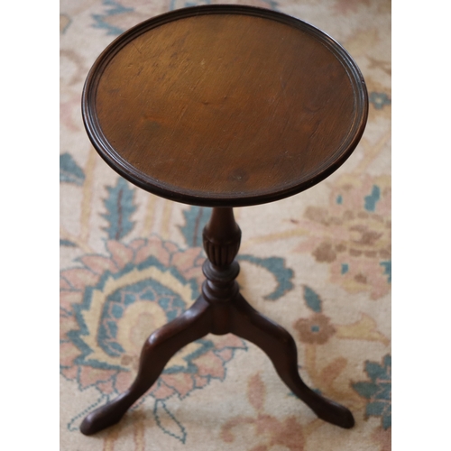 1043 - A small mahogany low-level round table on 3 legs, 50cm high, 29.5cm diameter to top. This Lot is not... 