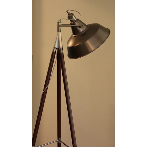 1044 - A modern floor lamp on wood and metal tripod legs with metallic adjustable shade, 149cm high overall... 