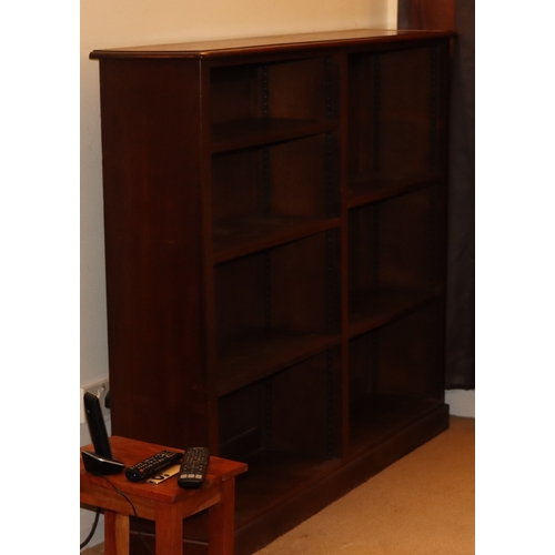 1047 - A dark wood open bookcase with 5 adjustable shelves, 150cm wide, 29cm deep, 123.5cm high. This Lot i... 