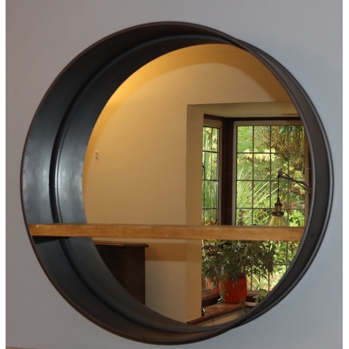 1048 - A modern wall mirror with metallic circular frame, wood shelf to mirror, 80cm diameter.This Lot is n... 