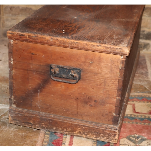 1051 - A wooden trunk with metal pull handles and lock (no key), hinged lid, 93cm wide, 43cm deep, 39cm hig... 