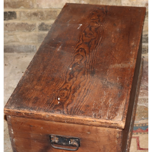 1051 - A wooden trunk with metal pull handles and lock (no key), hinged lid, 93cm wide, 43cm deep, 39cm hig... 