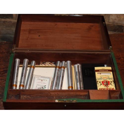 1052 - A small wooden writing box with hinged lid enclosing small interior compartments and a quantity of v... 