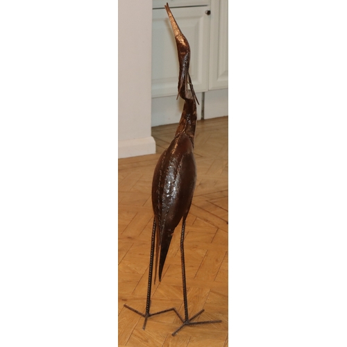 1058 - A metal heron ornament, 104cm high overall.