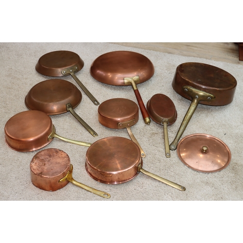 1064 - 9 various copper pans, 1 with lid.