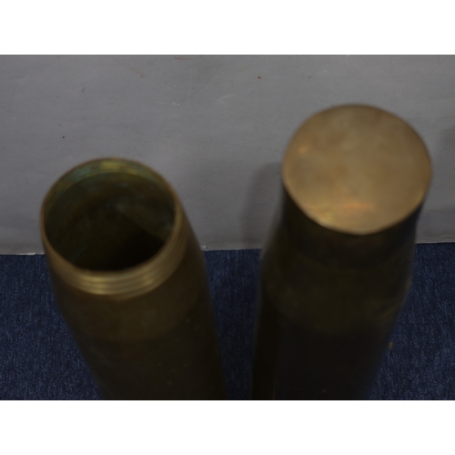 1086 - 2 long brass military shell cases, 70.3cm  and 6.2cm tall