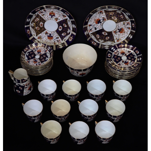 1098 - A quantity of china, 11 cups, 12 saucers, 12 side plates, 2 serving plates, 1 jug, 1 bowl.