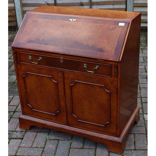 1103 - A good quality reproduction walnut bureau with bonded and inlaid stringing decoration, fall front en... 