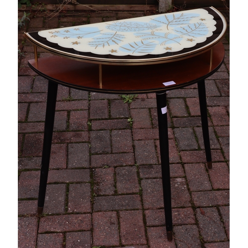 1106 - A 1950's teak low bow fronted console table with black and white glass top, gilt leaf decoration, ro... 