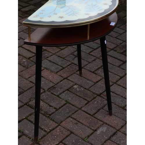 1106 - A 1950's teak low bow fronted console table with black and white glass top, gilt leaf decoration, ro... 