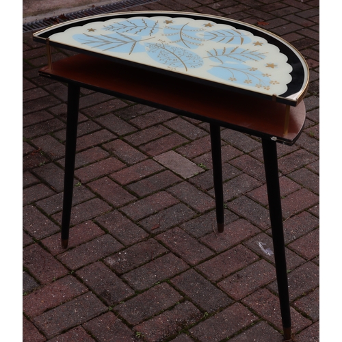 1106 - A 1950's teak low bow fronted console table with black and white glass top, gilt leaf decoration, ro... 