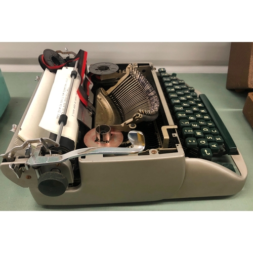 1115 - A vintage Remington Travel -Riter serial number GR 27892, in hard case and a Smith Corona portable t... 