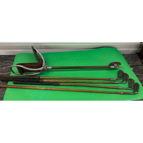 1136 - A Gamebird shooting stick and 4 early golf clubs