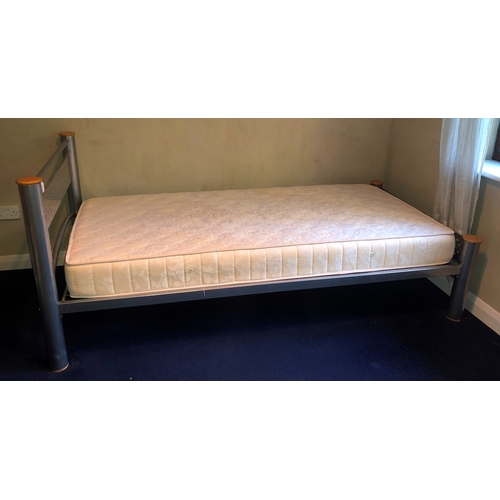 1143 - A metallic single bed frame with single mattress, frame 207cm long overall 103cm wide. This Lot is n... 