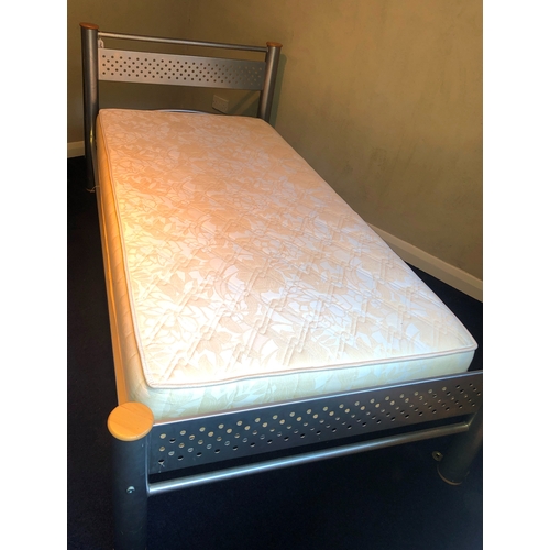 1143 - A metallic single bed frame with single mattress, frame 207cm long overall 103cm wide. This Lot is n... 