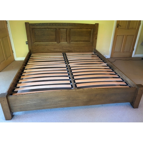 1156 - An oak bed frame with fitted headboard and footboard, wooden bed slats, frame 197cm wide, 215cm long... 