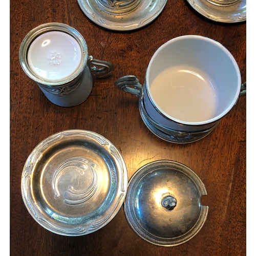 1176 - A set of 12 Italian white china and silver coloured coffee cups, 12 saucers and 1 sugar bowl with li... 