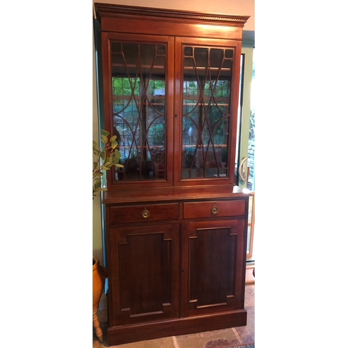 1180 - An Edwardian mahogany cabinet with 2 glazed doors enclosing 3 shelves, 2 drawers below, 2 panel cupb... 