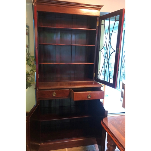 1180 - An Edwardian mahogany cabinet with 2 glazed doors enclosing 3 shelves, 2 drawers below, 2 panel cupb... 