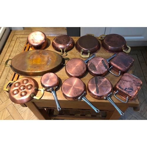 1202 - A quantity of heavy based copper and stainless steel small pans etc.