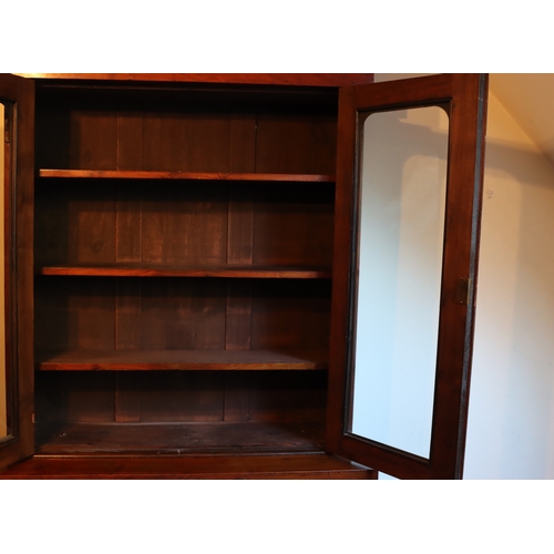 1272 - A Victorian mahogany bookcase with 2  glazed panel doors enclosing  shelves, 1 drawer and 2 panel do... 