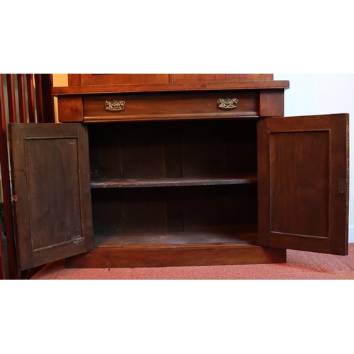 1272 - A Victorian mahogany bookcase with 2  glazed panel doors enclosing  shelves, 1 drawer and 2 panel do... 