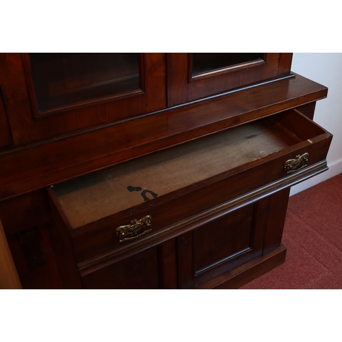 1272 - A Victorian mahogany bookcase with 2  glazed panel doors enclosing  shelves, 1 drawer and 2 panel do... 