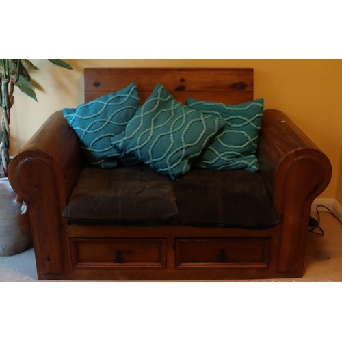 1280 - A heavy stained pine 2-seater bench with 2 drawers below, 2 dark brown suede style base cushions and... 