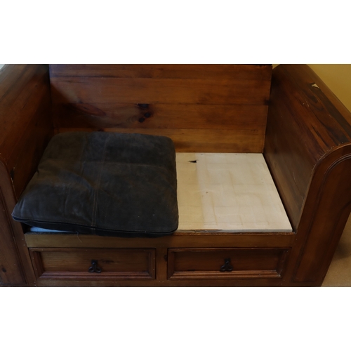 1280 - A heavy stained pine 2-seater bench with 2 drawers below, 2 dark brown suede style base cushions and... 