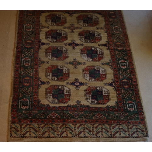 1282 - A red, cream, green and blue rug with tassels, 202 x 140cm.