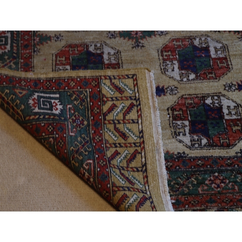 1282 - A red, cream, green and blue rug with tassels, 202 x 140cm.