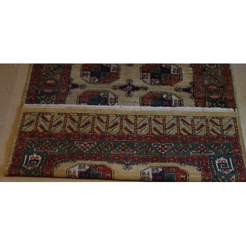 1282 - A red, cream, green and blue rug with tassels, 202 x 140cm.