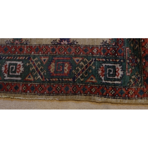 1282 - A red, cream, green and blue rug with tassels, 202 x 140cm.