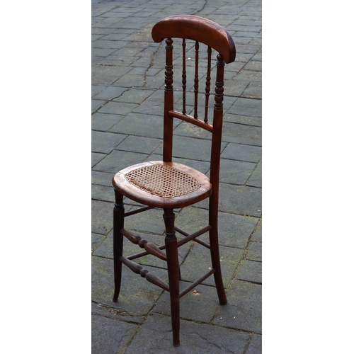 1290 - A tall child's chair with cane seat, 105cm high. This Lot is not held by PF Windibank. Please call t... 