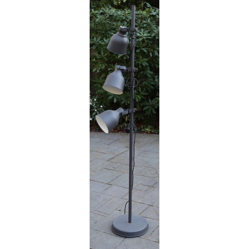 1293 - A grey brushed metal floor lamp with 3 adjustable lights and matching metal shades, 175cm high. This... 