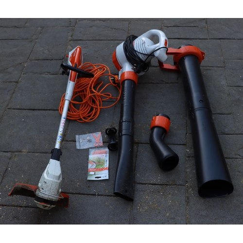 1294 - An Stihl electric garden strimmer, model  FSA458 and an Stihl leaf blower, model FHE71. This Lot is ... 