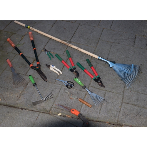 1296 - A quantity of garden tools including a long handled rake, secateurs etc. This Lot is not held by PF ... 