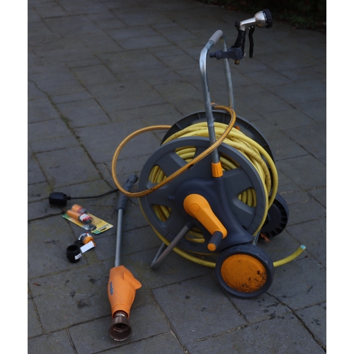 1297 - A Hozelock hose and reel on wheels and various attachments. This Lot is not held by PF Windibank. Pl... 